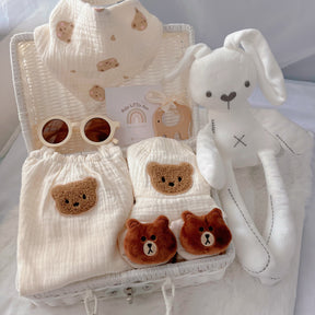 Summer Bear premium baby gift set in a rattan basket with bear-themed summer romper