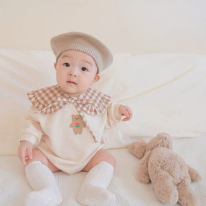 Baby wearing the Sweater Bear long-sleeve bear sweater romper