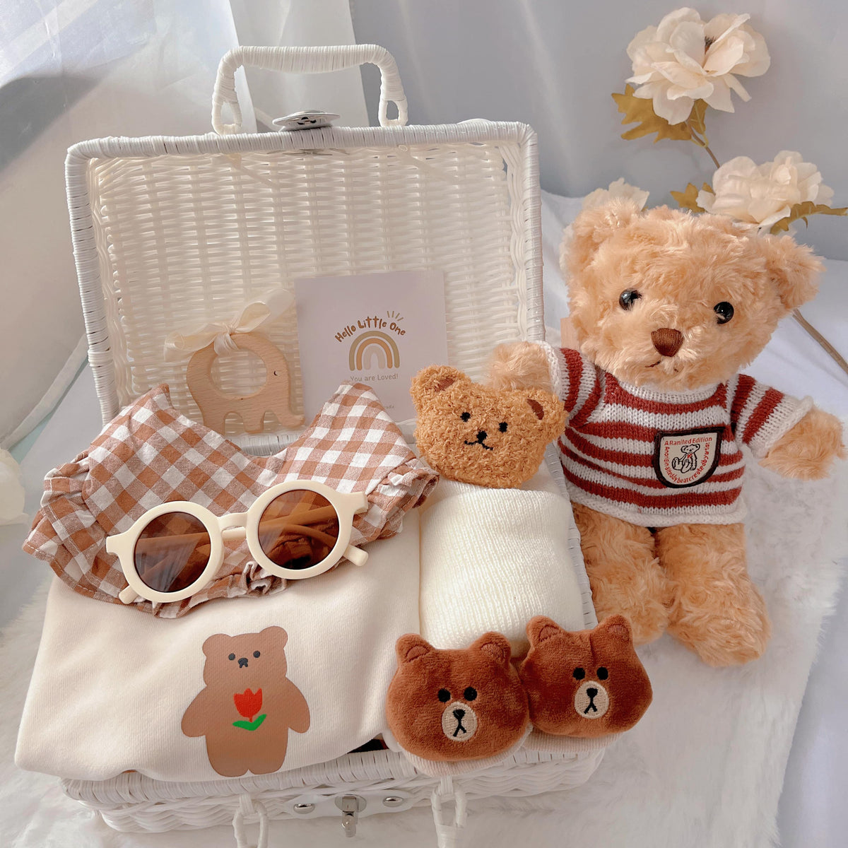 Sweater Bear premium baby gift set in a rattan basket with long-sleeve bear sweater romper